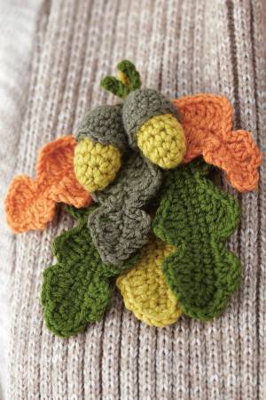 Crocheted acorn and oak leaf corsage with autumn colours
