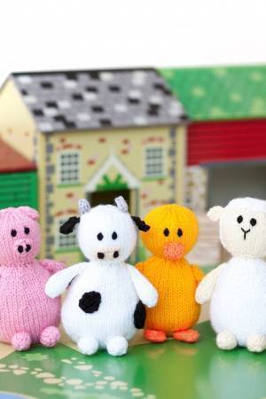 Knitted farmyard friends pig, cow, duck and sheep 