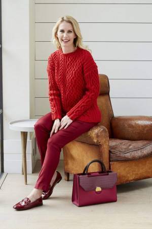 Ladies red asymmetrical cable sweater knitting pattern