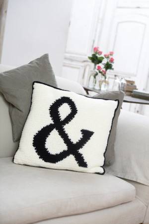 Crochet cushion with ampersand as part of the design