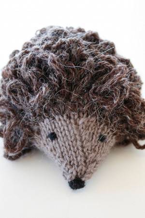 Small knitted hedgehog toy