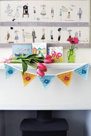 Crocheted bunting with flower motif on each pennant