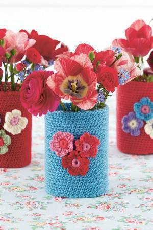 Crocheted vase with flower motif on front