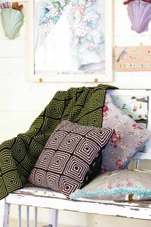 Knitted geometric cushion and matching throw
