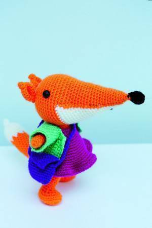 Crocheted lady fox toy with bright dress
