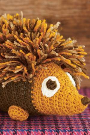 Crocheted hedgehog with tasselled back and cute face