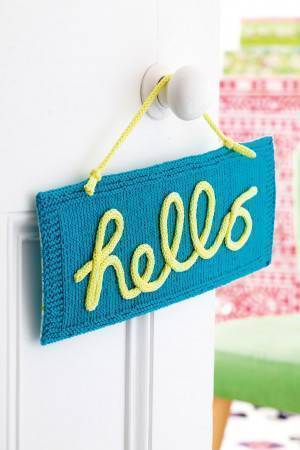 Knitted hello sign to hang in the home