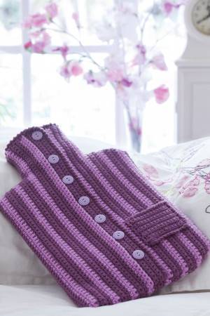 Striped crochet hot water bottle cover in jumper style with buttons and pocket