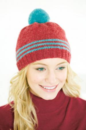 Knitted hat for women with stripes and bobble