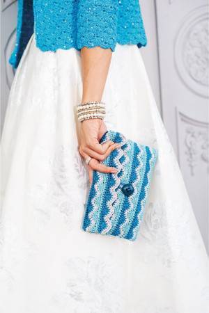 Crocheted clutch bag with zig-zag pattern with shades of blue and grey