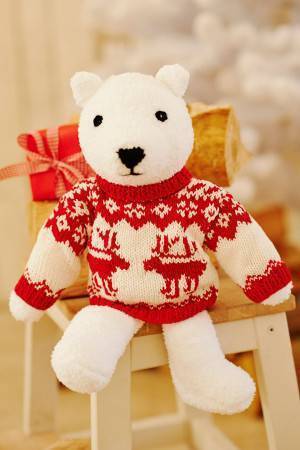 Toy knitted polar bear with long-sleeved reindeer jumper 