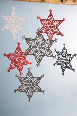 Suspended crocheted stiff snowflakes in red, white and grey