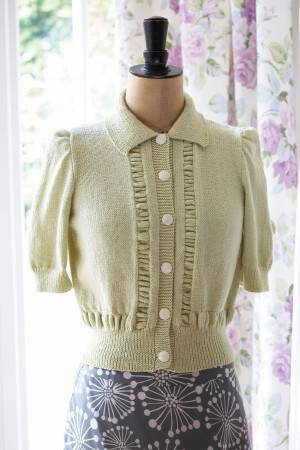 Vintage knit cardigan with ruffled details and short puff sleeves
