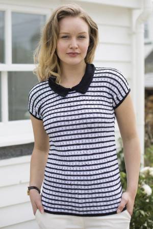 Lady wearing a monochrome striped top with collar