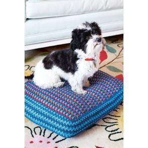 Colourful crocheted dog cushion
