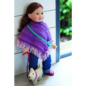 Doll dressed in a purple poncho with a small knitted dog toy