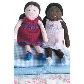 Two knitted dolls in striped dresses and pretty shoes with bows
