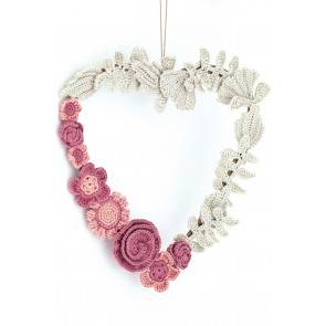 Crocheted heart decoration with assortment of flowers in pinks and white