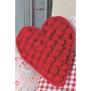 Bold heart crochet cushion with big bobbles and neat trim