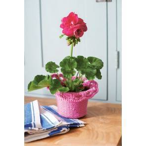 Knitted flower plant pot cover with curled frilled edge 