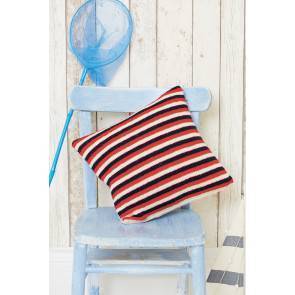 Knitted cushion cover with thin stripes in three colours on one side and cable on reverse