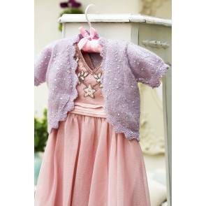 Sparkly knitted bolero cardigan for a child with scalloped edging