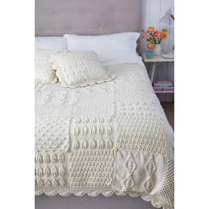 Knitted bed topper and matching cushion