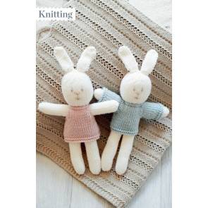 Knitted boy and girl bunny toys