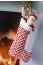 Knitted chimney stocking with Santa toy